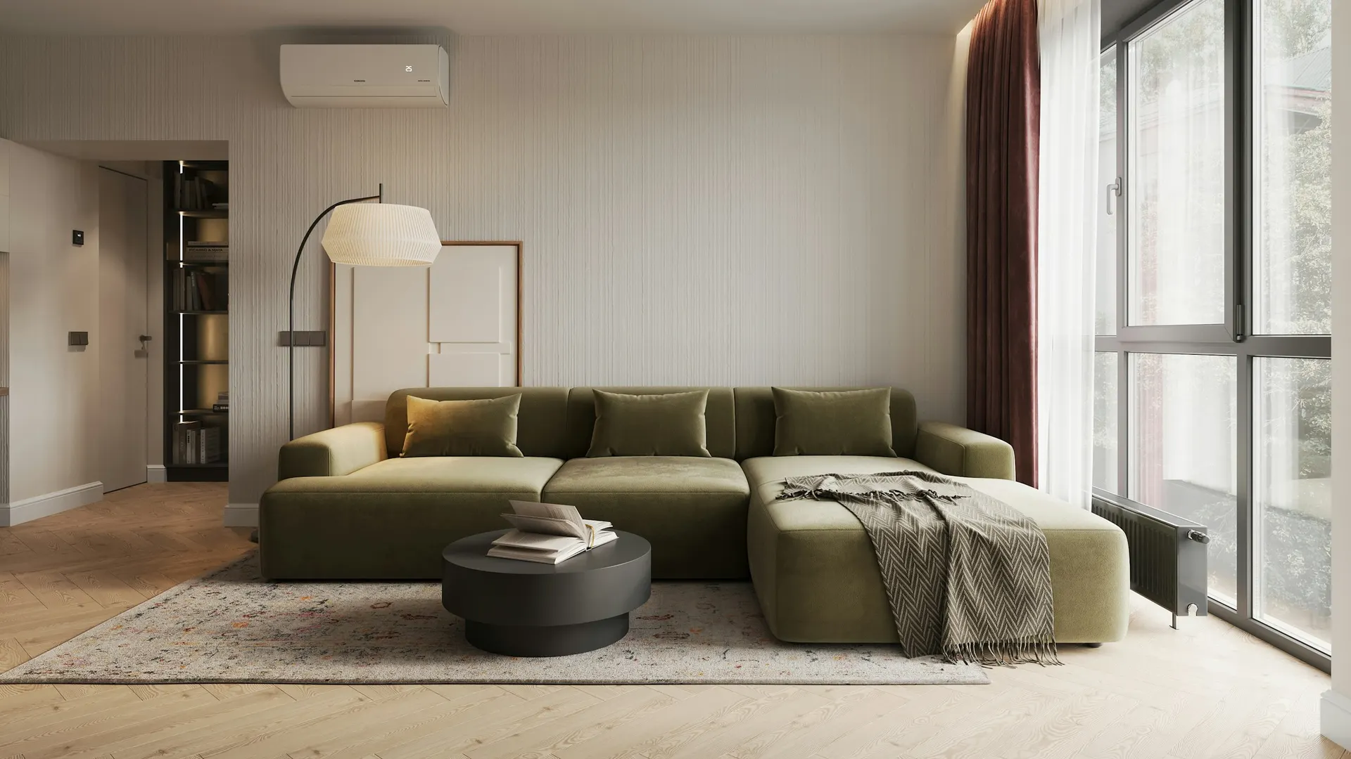 Living sereno con sofá verde y un gran ventanal